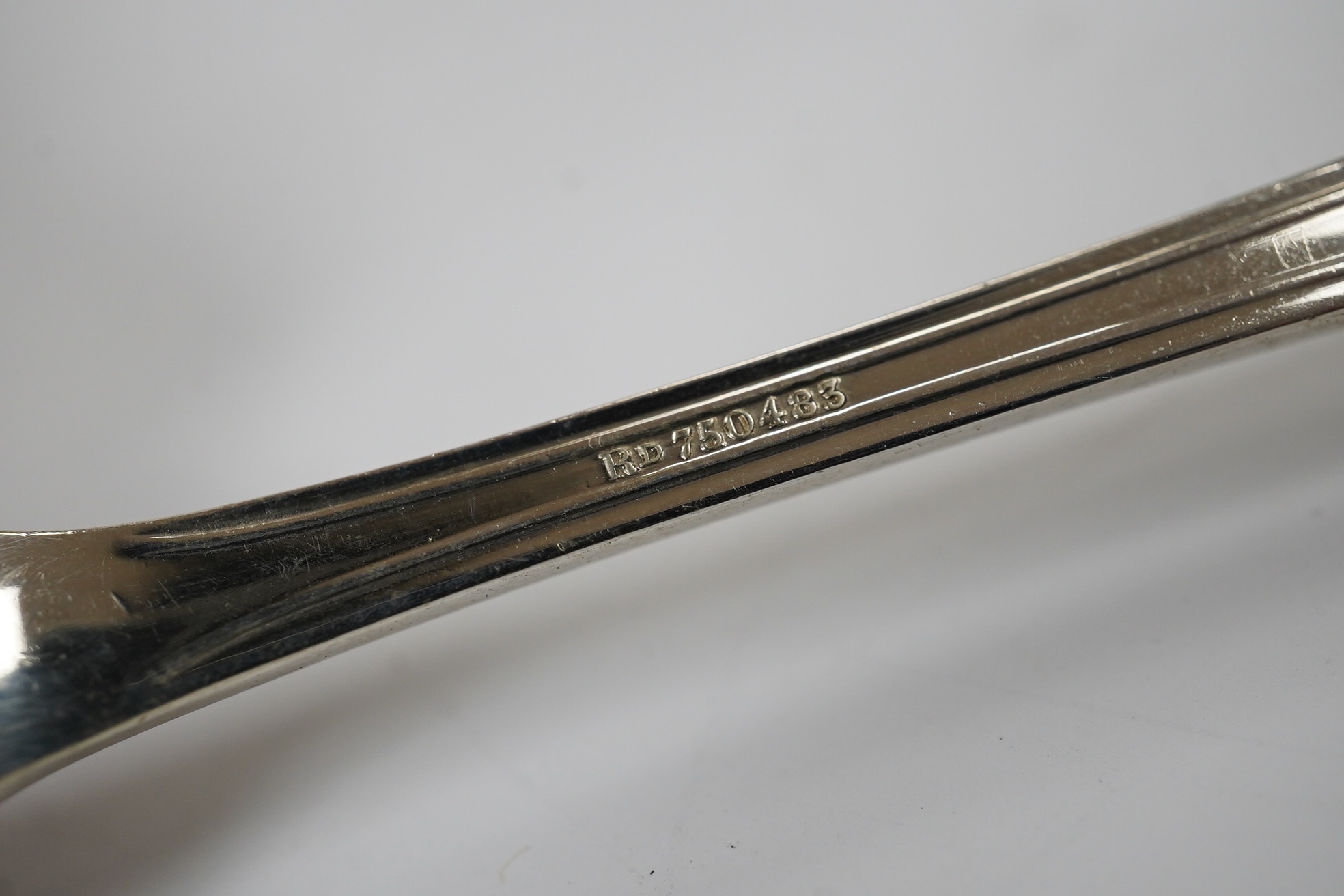 A cased set of eight George V silver grapefruit spoons, Sheffield, 1933 and a pair of silver spill vases, 17.5cm. Condition - poor to fair